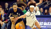 Notre Dame junior Hannah Hidalgo goes for a steal against Akron