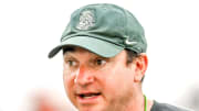 Michigan State's head coach Jonathan Smith talks with the team during camp on Monday, Aug. 5, 2024, at the indoor practice facility in East Lansing.