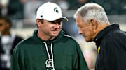 Michigan State head coach Jonathan Smith talks with Iowa head coach Kirk Ferentz before the game Saturday, Oct. 19, 2024, at Spartan Stadium in East Lansing.