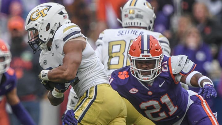 Clemson linebacker Kobe McCloud (21) tackles Georgia Tech running back Dontae Smith (4) during the third quarter Nov 11, 2023; Clemson, South Carolina, USA; at Memorial Stadium.