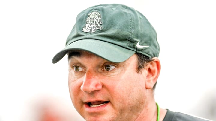 Michigan State's head coach Jonathan Smith talks with the team during camp on Monday, Aug. 5, 2024, at the indoor practice facility in East Lansing.