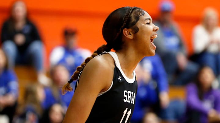 South Bend Washington junior Kira Reynolds celebrates after making a shot while drawing a foul during a Class 4A regional girls basketball championship game against Lake Central Saturday, Feb. 10, 2024, at LaPorte High School. South Bend Washington junior Kira Reynolds celebrates after making a shot while drawing a foul during a Class 4A regional girls basketball championship game against Lake Central Saturday, Feb. 10, 2024, at LaPorte High School.