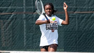 Westwood's Kinaa Graham makes a return on her way to the girls singles title at the District 25-6A tennis tournament at Old Settlers Park on April 4-5, 2022.