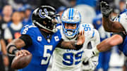 Detroit Lions defensive end Za'Darius Smith pressures Indianapolis Colts quarterback Anthony Richardson during an NFL game