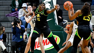 Michigan State's Grace VanSlooten, left, guards Oregon's Phillipina Kyei, center, during the first quarter on Thursday, Jan. 30, 2025, at the Breslin Center in East Lansing.