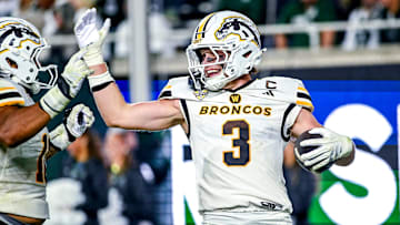 Western Michigan's Tate Hallock celebrates his interception for a touchdown against Michigan State during the fourth quarter on Friday, Aug. 29, 2025, in East Lansing.