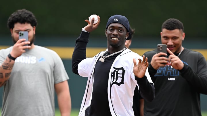 Detroit Lions cornerback Terrion Arnold throws out the first pitch of the Detroit Tigers game 