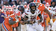 Nov 30, 2024; Clemson, South Carolina, USA; South Carolina quarterback LaNorris Sellers (16) runs away from Clemson defensive end T.J. Parker (3) during the fourth quarter at Memorial Stadium. Mandatory Credit: Ken Ruinard-Imagn Images