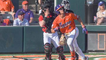 Clemson catcher Jacob Jarrell (9) hits a home run against University of Louisville during the bottom of the fifth inning at Doug Kingsmore Stadum in Clemson, S.C. Friday, April 18, 2025. The home run broke up a no-hitter and helped the Tigers win 2-1.
