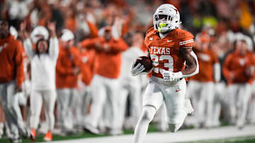 Texas running back Jaydon Blue runs the ball in to score a touchdown in the second quarter of the Longhorns' game against the Texas Tech Red Raiders.
