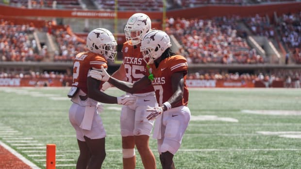 Texas Longhorns wide receiver Matthew Golden (2) celebrates with tight end Gunnar Helm (85) and wide receiver Isaiah Bond (7)