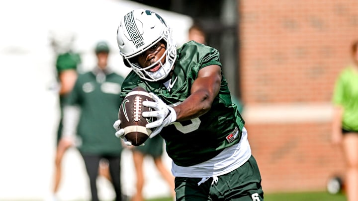 Michigan State's Nick Marsh catches a pass during the first day of football camp on Tuesday, July 30, 2024, in East Lansing.