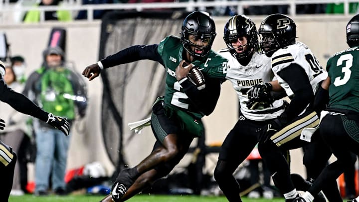 Michigan State's Aidan Chiles runs for a gain against Purdue during the first quarter on Friday, Nov. 22, 2024, at Spartan Stadium in East Lansing.