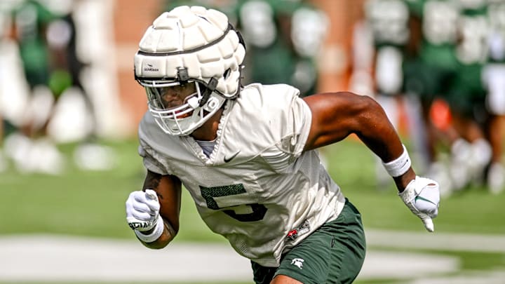 Michigan State's Jordan Hall runs a drill during the first day of football camp on Tuesday, July 30, 2024, in East Lansing.