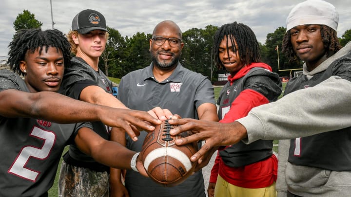 Sharode Richardson, Cutter Woods, Coach Brian Lane, Armoni Weaver and Chamarryus Bomar,at Westside High in Anderson, S.C.