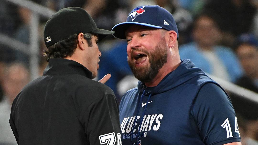 Toronto Blue Jays manager john Schneider argues with umpire John Trumpane. Toronto Blue Jays manager john Schneider argues with umpire John Trumpane.