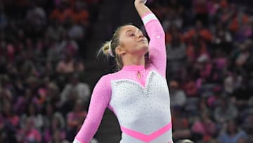 Clemson freshman Sierra Church of Lincolnton, North Carolina begins the beam during the gymnastics meet with University of North Carolina at Littlejohn Coliseum in Clemson Friday, February 23, 2024.