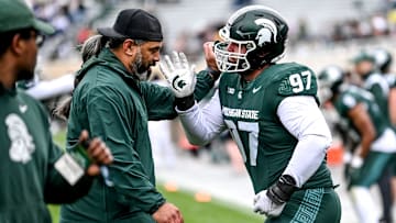 Michigan State's Maverick Hansen, right, works with defensive line coach Legi Suiaunoa during the Spring Showcase on Saturday, April 20, 2024, at Spartan Stadium in East Lansing.