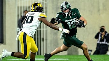 Michigan State's Jack Velling, right, runs after a catch as Iowa's Nick Jackson closes in during the third quarter on Saturday, Oct. 19, 2024, at Spartan Stadium in East Lansing.