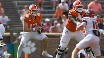 Sep 21, 2024; Clemson, South Carolina, USA; Clemson Tigers quarterback Christopher Vizzina (17) runs against North Carolina State Wolfpack linebacker Caden Fordham (10) during the third quarter at Memorial Stadium. Mandatory Credit: Ken Ruinard-Imagn Images