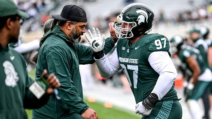 Michigan State's Maverick Hansen, right, works with defensive line coach Legi Suiaunoa during the Spring Showcase on Saturday, April 20, 2024, at Spartan Stadium in East Lansing.