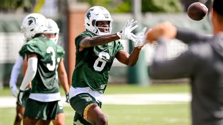 Michigan State's Nick Marsh catches a pass during the first day of football camp on Tuesday, July 30, 2024, in East Lansing.