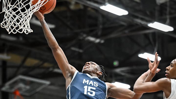 Milwaukee Academy of Science guard Jamarion Batemon (15) goes to the basket against West Allis Central guard Isaiah Fox (5) in a game Wednesday, November 27, 2024, at West Allis Central High School in West Allis, Wisconsin. Batemon and the
