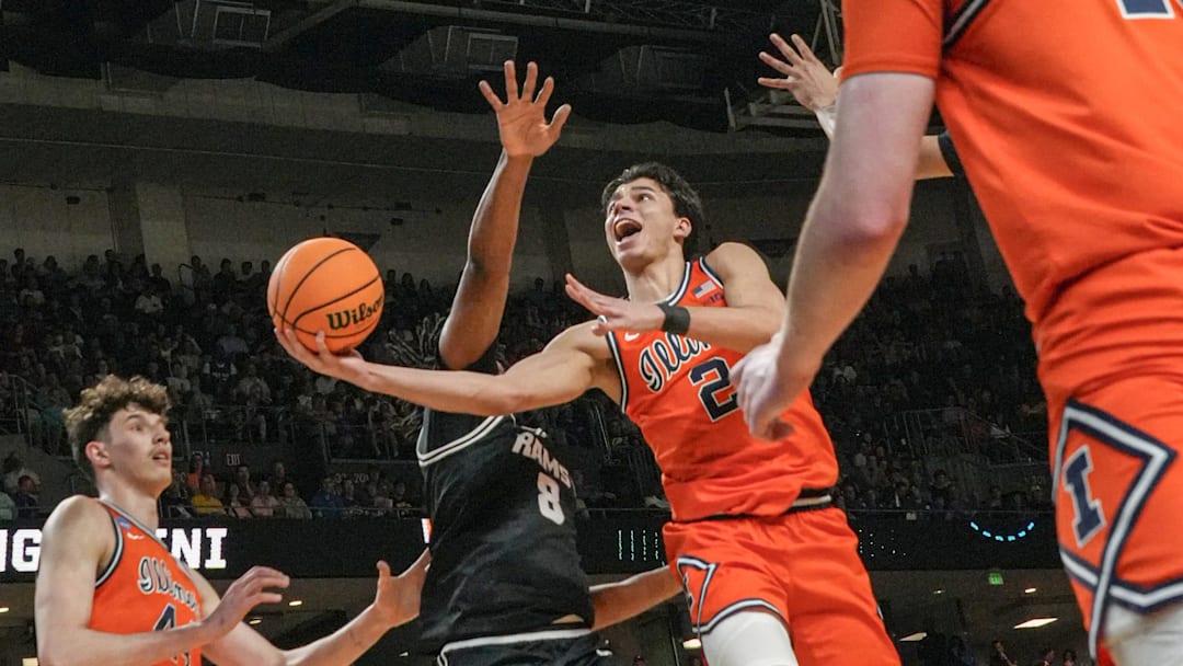 Illinois Fighting Illini guard Andrej Stojakovic (2) scores near VCU Rams forward Michael Belle (8) March 21, 2026 during the first half of the NCAA Men’s Basketball Tournament second round East Region game at the Bon Secours Wellness Arena in Greenville, South Carolina.