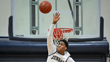 Milwaukee Juneau guard Dooney Johnson (1) elevates to block a shot against Milwaukee Hamilton in a game Friday, January 17, 2025, at MacDowell Montessori School in Milwaukee, Wisconsin.