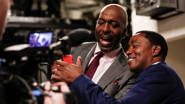 Isiah Thomas and John Salley try to set up live video on a phone before they walked out of the tunnel for the 30th anniversary of the 1989-90 back-to-back championships at the Little Caesars Arena in Detroit, Saturday, March 30, 2019.

03302019 Pistons Halftime 14