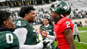 Michigan State's Aidan Chiles, right, talks with Derrick Harmon after the Spring Showcase on