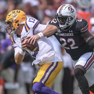 Louisiana State University quarterback Garrett Nussmeier (13) tries to avoid getting sacked by South Carolina linebacker Bam Martin-Scott (22) during the first quarter at Williams-Brice Stadium in Columbia, S.C. Saturday, September 14, 2024.