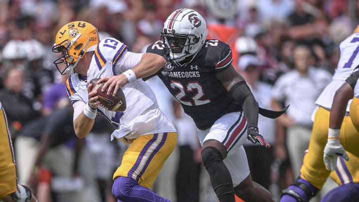 Louisiana State University quarterback Garrett Nussmeier (13) tries to avoid getting sacked by South Carolina linebacker Bam Martin-Scott (22) during the first quarter at Williams-Brice Stadium in Columbia, S.C. Saturday, September 14, 2024.