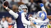 Detroit Lions defensive end Aidan Hutchinson tries to sack Dallas Cowboys quarterback Dak Prescott
