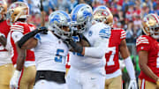 Lions running back David Montgomery, left, and offensive tackle Penei Sewell celebrate a touchdown in the first quarter of the NFC championship game at Levi's Stadium in Santa Clara, California, on Sunday, Jan. 28, 2024.