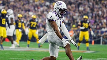TCU cornerback Tre'Vius Hodges-Tomlinson (1) celebrates a play against Michigan.