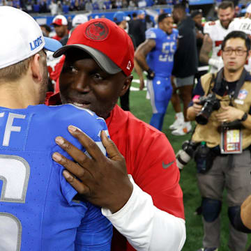 Detroit Lions quarterback Jared Goff and Tampa Bay Buccaneers head coach Todd Bowles hug at midfield at the end of the NFC divisional playoff game at Ford Field in Detroit on Sunday, Jan. 21, 2024.