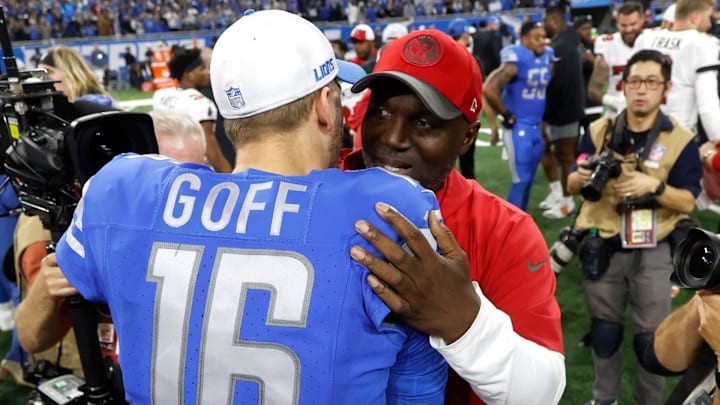 Detroit Lions quarterback Jared Goff and Tampa Bay Buccaneers head coach Todd Bowles hug at midfield at the end of the NFC divisional playoff game at Ford Field in Detroit on Sunday, Jan. 21, 2024.