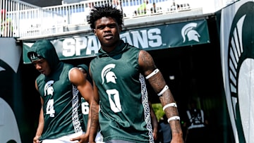 Michigan State's Ed Woods, left, and Charles Brantley take the field to warm up before the football game against Prairie View A&M on Saturday, Sept. 14, 2024, at Spartan Stadium in East Lansing.