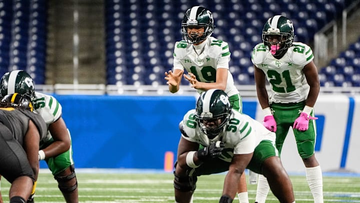 Detroit Cass Tech freshman quarterback Donald Tabron II calls for a snap as guard Jestin Wilson (50) prepares to block against Detroit King during the first half of PSL championship at Ford Field in Detroit on Friday, Oct. 18, 2024.