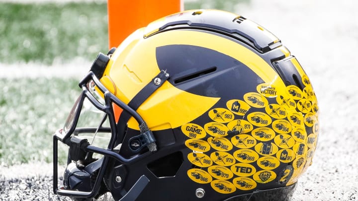 Michigan running back Blake Corum's helmet sits on the turf during warmups before the Ohio State game at Michigan Stadium in Ann Arbor on Saturday, Nov. 25, 2023.