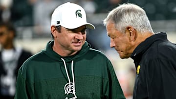Michigan State's head coach Jonathan Smith, left, talks with Iowa head coach Kirk Ferentz before MSU's game against the Hawkeyes on Saturday, Oct. 19, 2024, at Spartan Stadium in East Lansing.