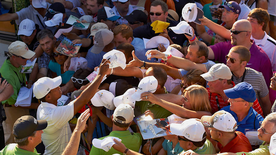 Tiger Woods signs autographs at the 2012 Arnold Palmer Invitational.