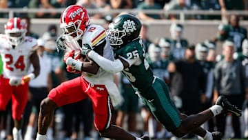 Michigan State defensive back Chance Rucker (25) tackles Maryland wide receiver Tai Felton (10) during the first half at Spartan Stadium in East Lansing on Saturday, Sept. 23, 2023.