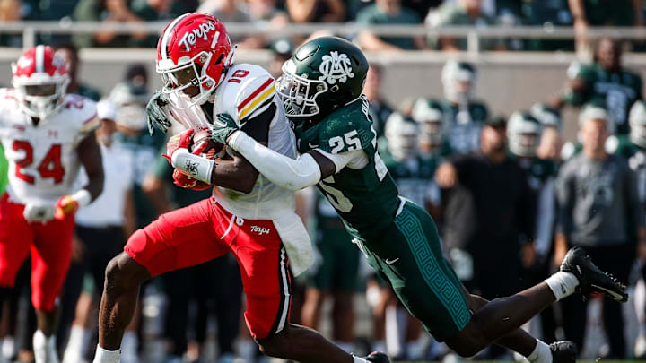 Michigan State defensive back Chance Rucker (25) tackles Maryland wide receiver Tai Felton (10) during the first half at Spartan Stadium in East Lansing on Saturday, Sept. 23, 2023.