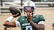 Michigan State's Aidan Chiles warms up before the football game against UCLA on Saturday, Oct. 11, 2025, at Spartan Stadium in East Lansing.