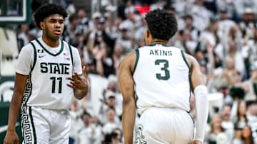 Michigan State's Jase Richardson, left, celebrates after Jaden Akins' 3-pointer against Michigan during the first half on Sunday, March 9, 2025, at the Breslin Center in East Lansing.