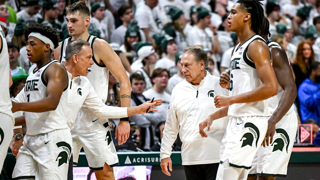Michigan State's associate head coach Doug Wojcik, left, talks with head coach Tom Izzo during a timeout in the second half against Duke on Saturday, Dec. 6, 2025, at the Breslin Center in East Lansing. Michigan State's associate head coach Doug Wojcik, left, talks with head coach Tom Izzo during a timeout in the second half against Duke on Saturday, Dec. 6, 2025, at the Breslin Center in East Lansing.