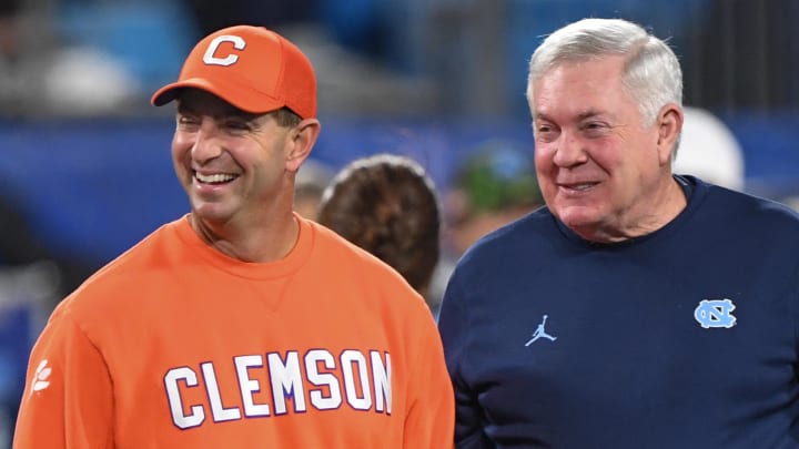 Clemson head coach Dabo Swinney and North Carolina Coach Mack Brown talk before the ACC Championship.