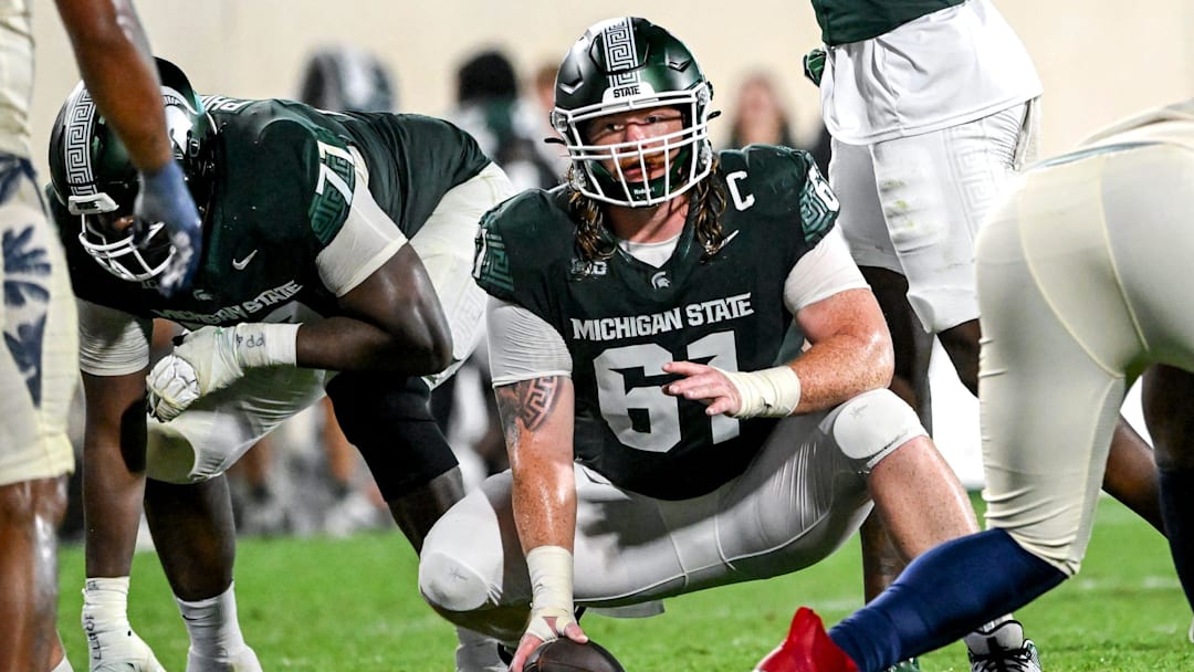 Michigan State's Tanner Miller prepares to snap the ball in the game against Florida Atlantic during the fourth quarter on Friday, Aug. 30, 2024, at Spartan Stadium in East Lansing.